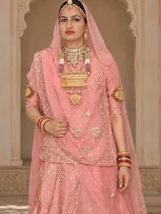 Peach pink kurti with zardozi vine motifs and jaal hem band, pure odhni with sequin border draped over the head