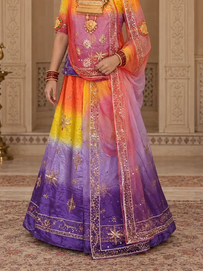 Lehenga close-up with orange, yellow, lavender and purple bands, zardozi star buttis and wide sequin hem border