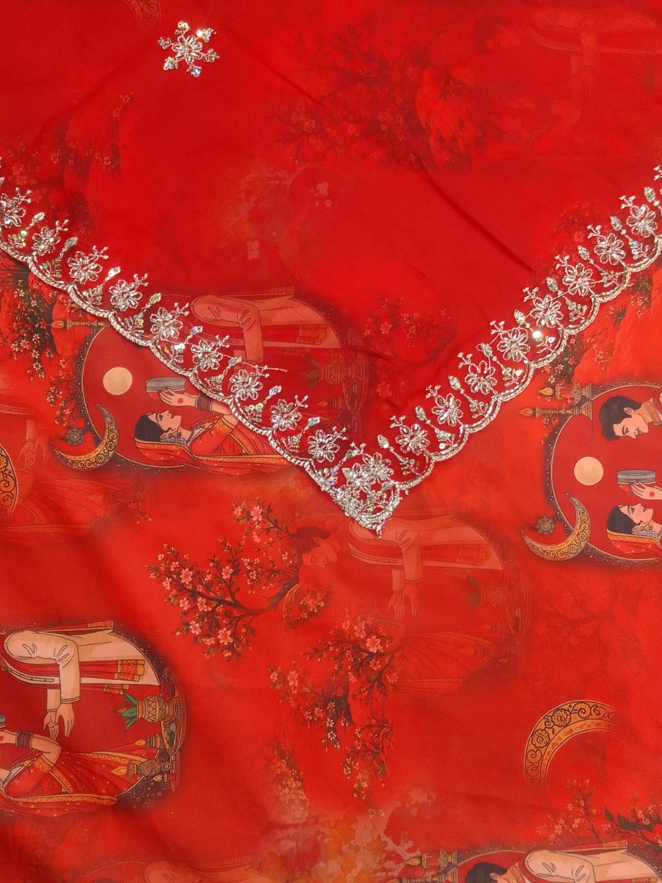 Red Karwa Chauth print BSY fabric with chalni and moon scenes, and Rajan odhni with cutwork sequin flower border