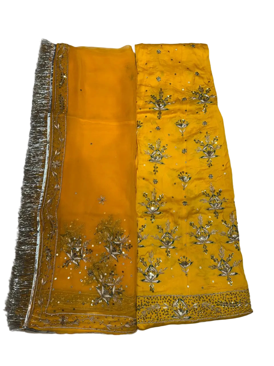 Yellow fabric with intricate gold embroidery on a white background