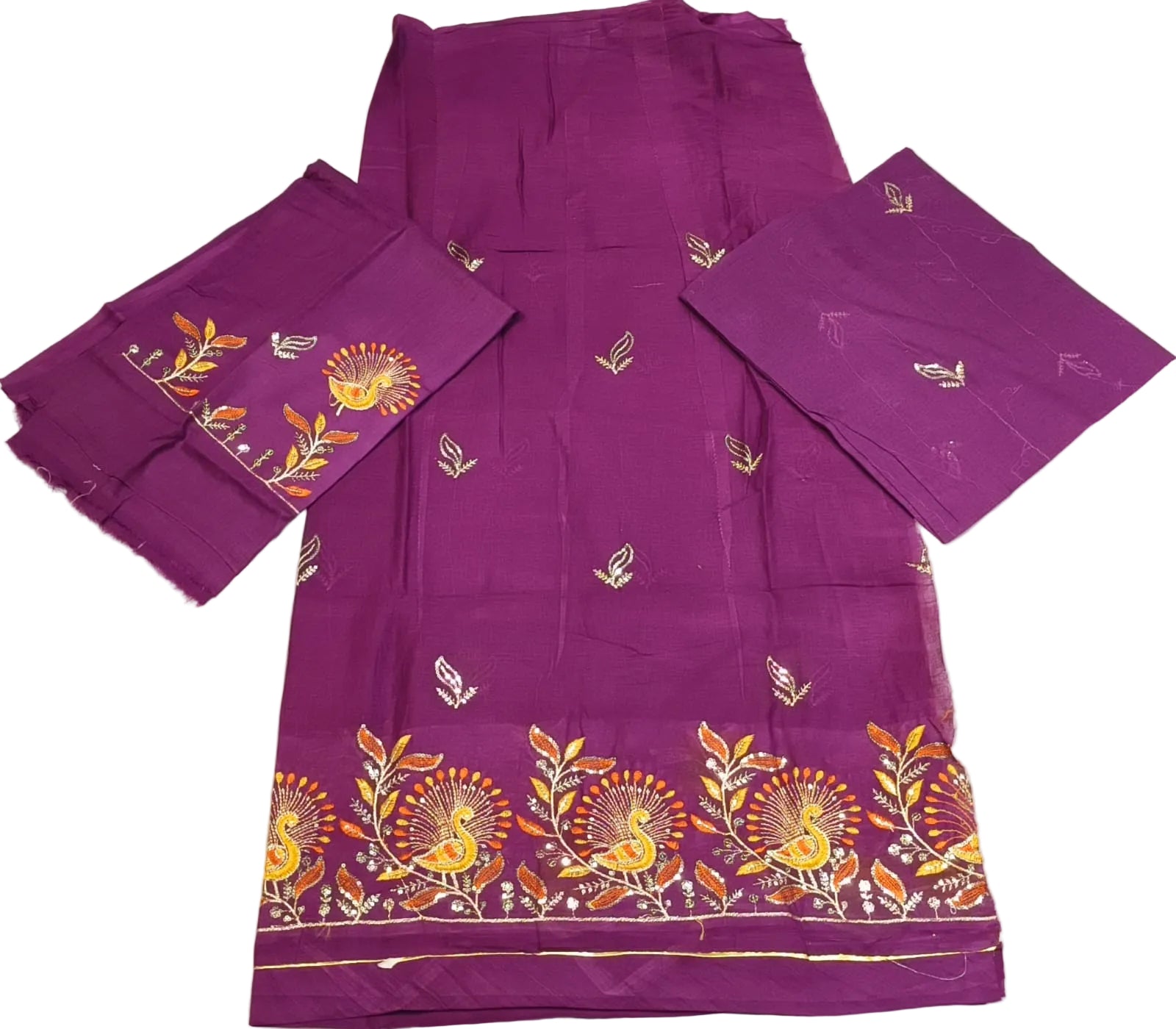 Purple fabric with floral patterns on a white surface