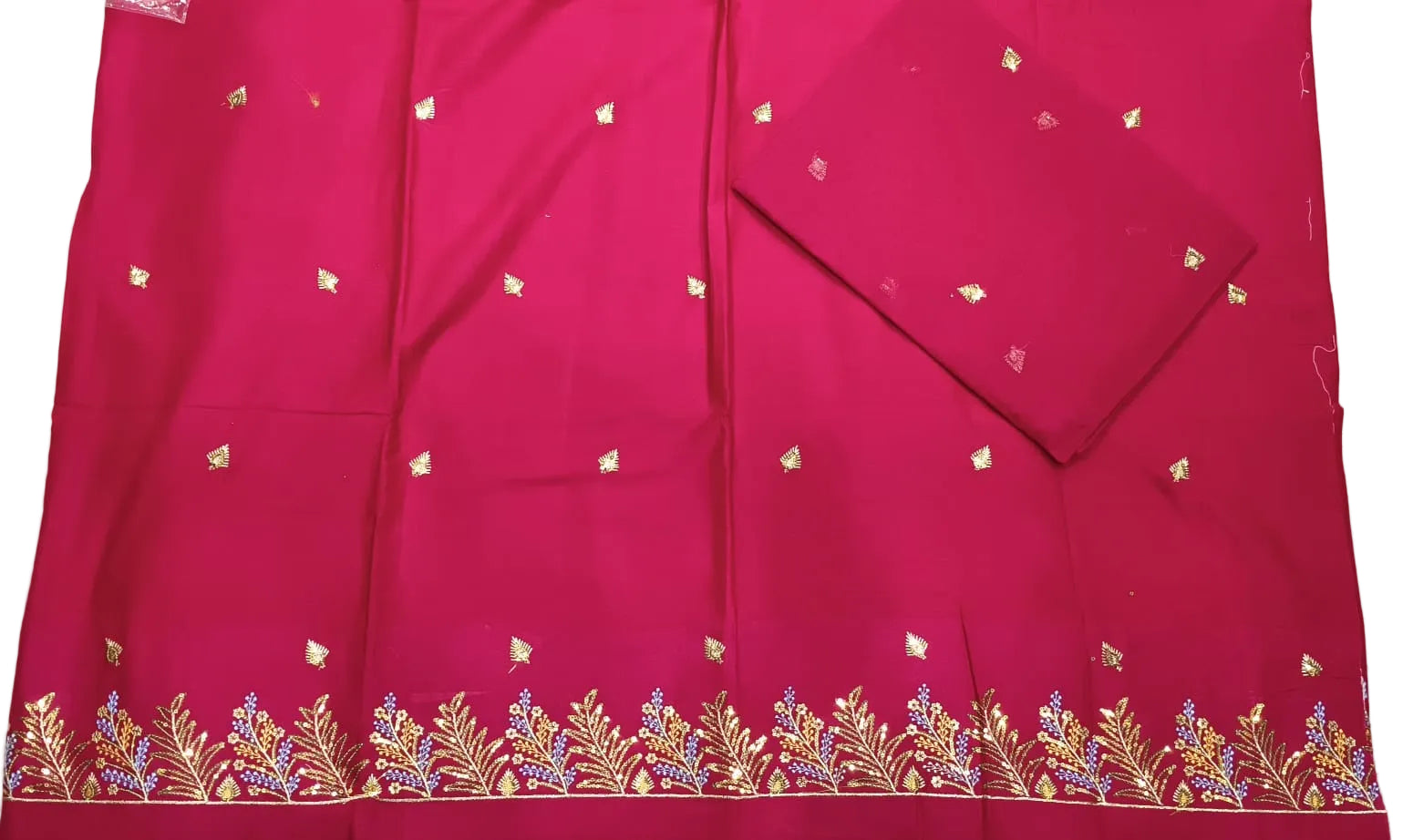 Red fabric with gold embroidery on a white background