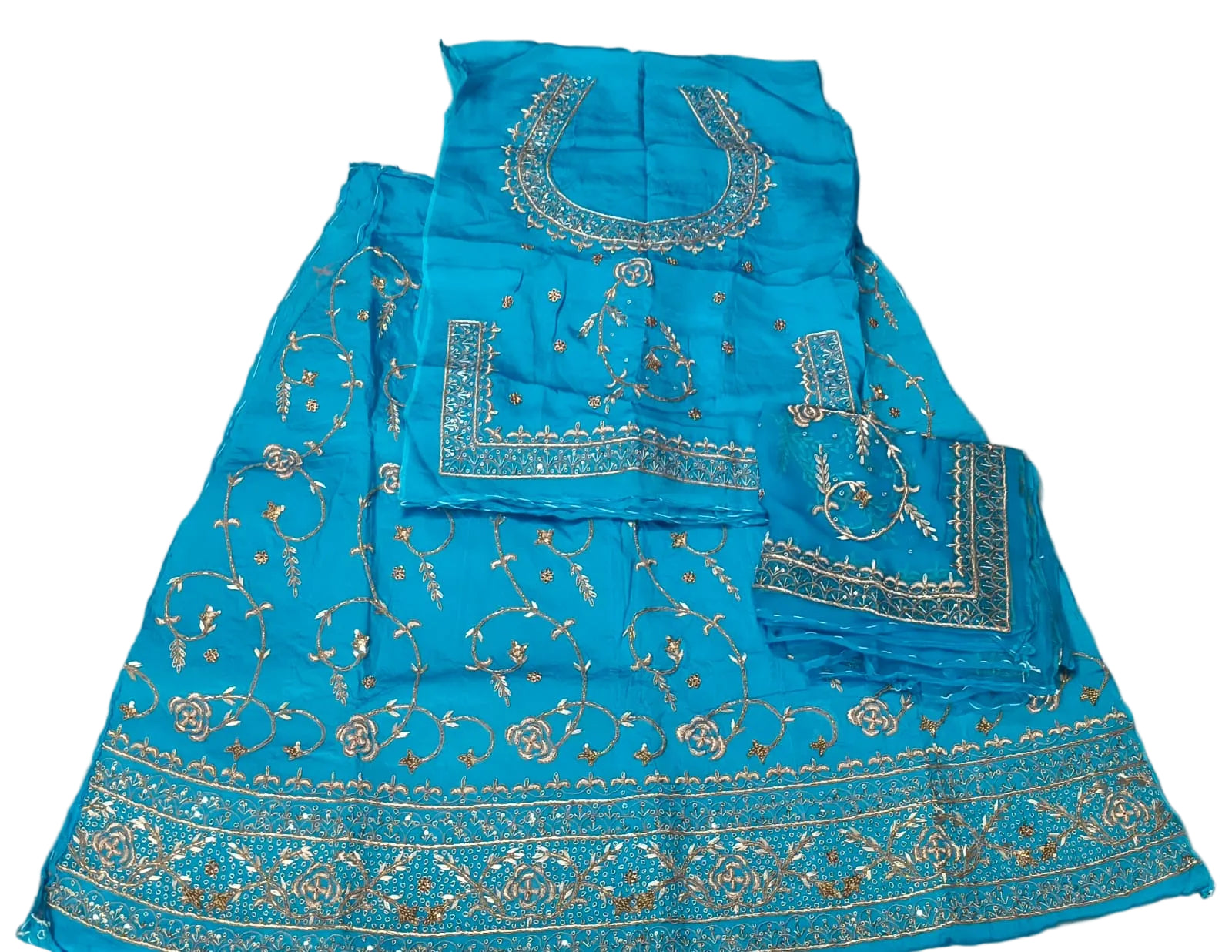 Blue embroidered fabric on a beige background