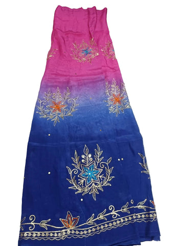 Pink blue rajputi poshak fabric shaded from rani pink to royal blue, with zari cutdana bootas and an orange lotus zari border