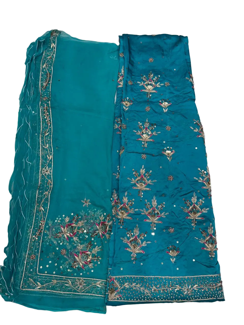Teal fabric with intricate gold embroidery on a white background