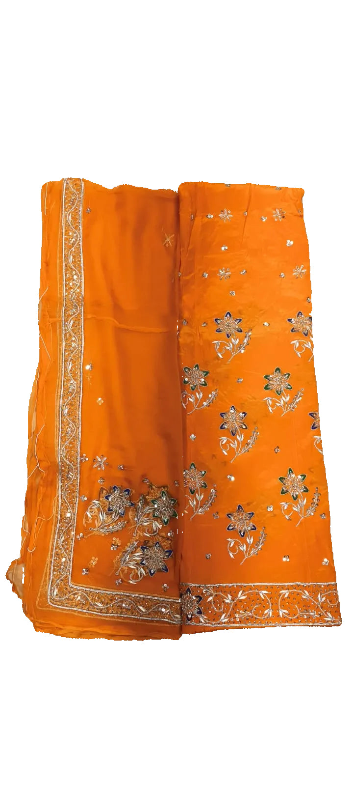 Orange fabric with floral patterns on a white bed