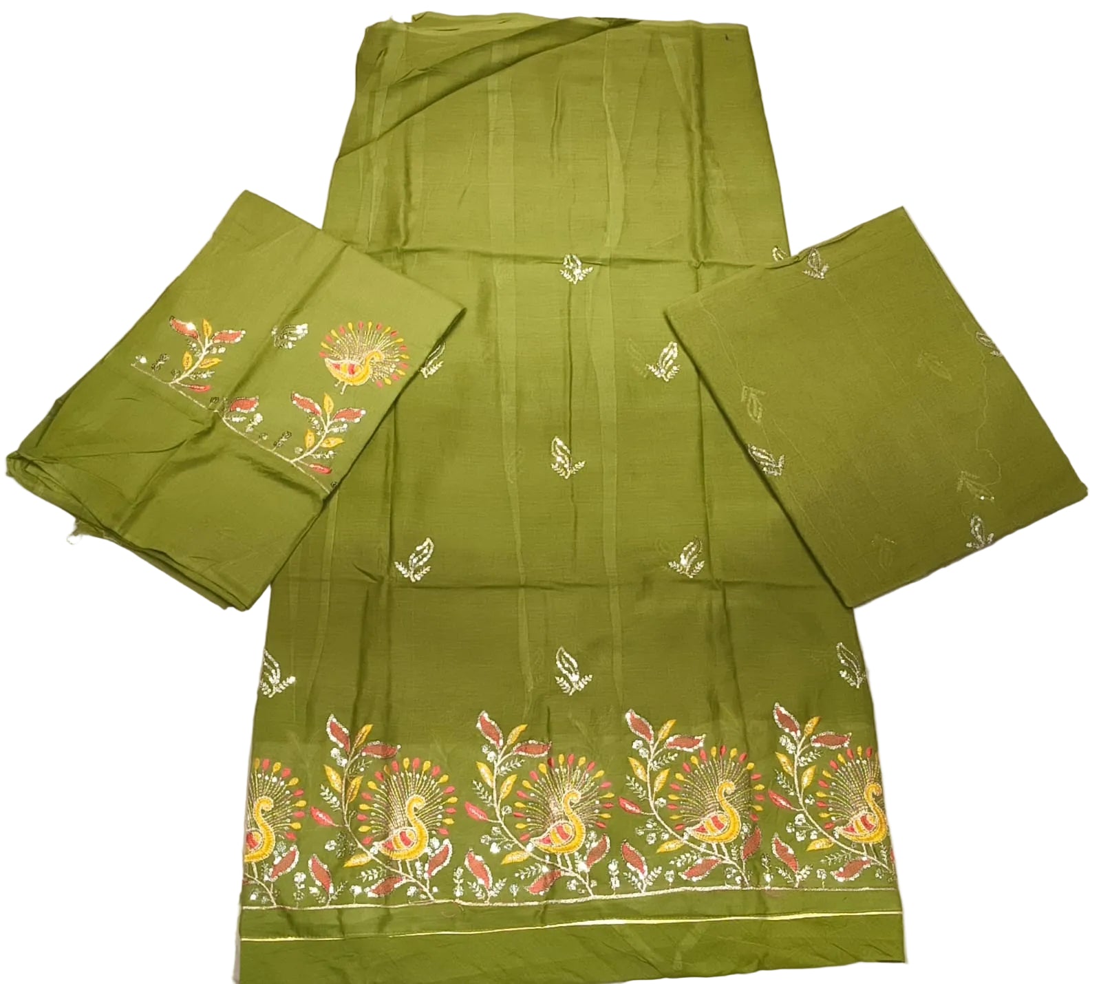 Green embroidered fabric with patterns on a white surface