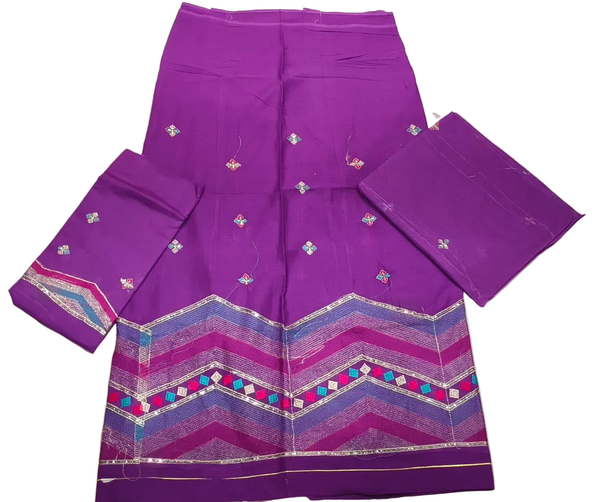 Purple saree with intricate patterns on a light background