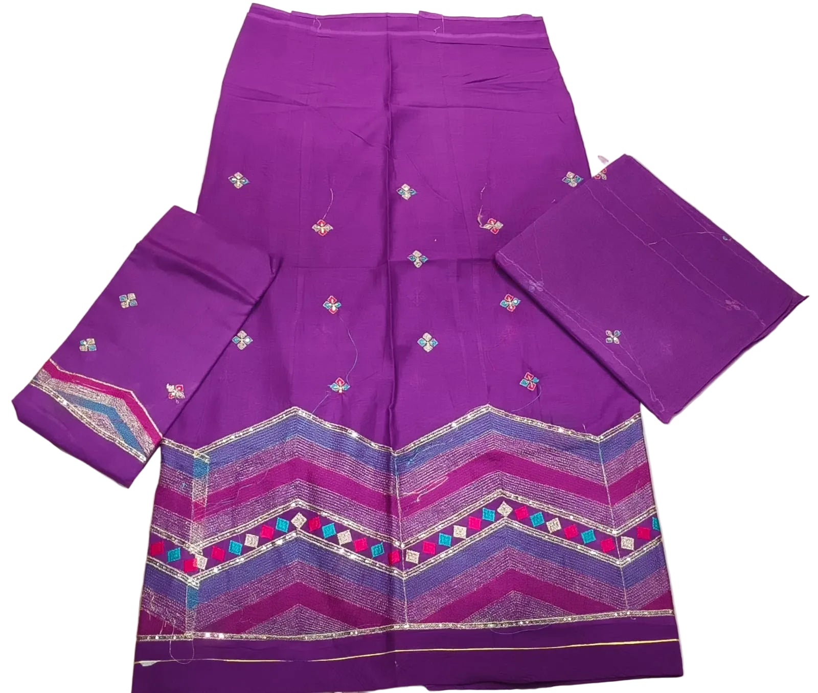 Purple saree with intricate patterns on a light background