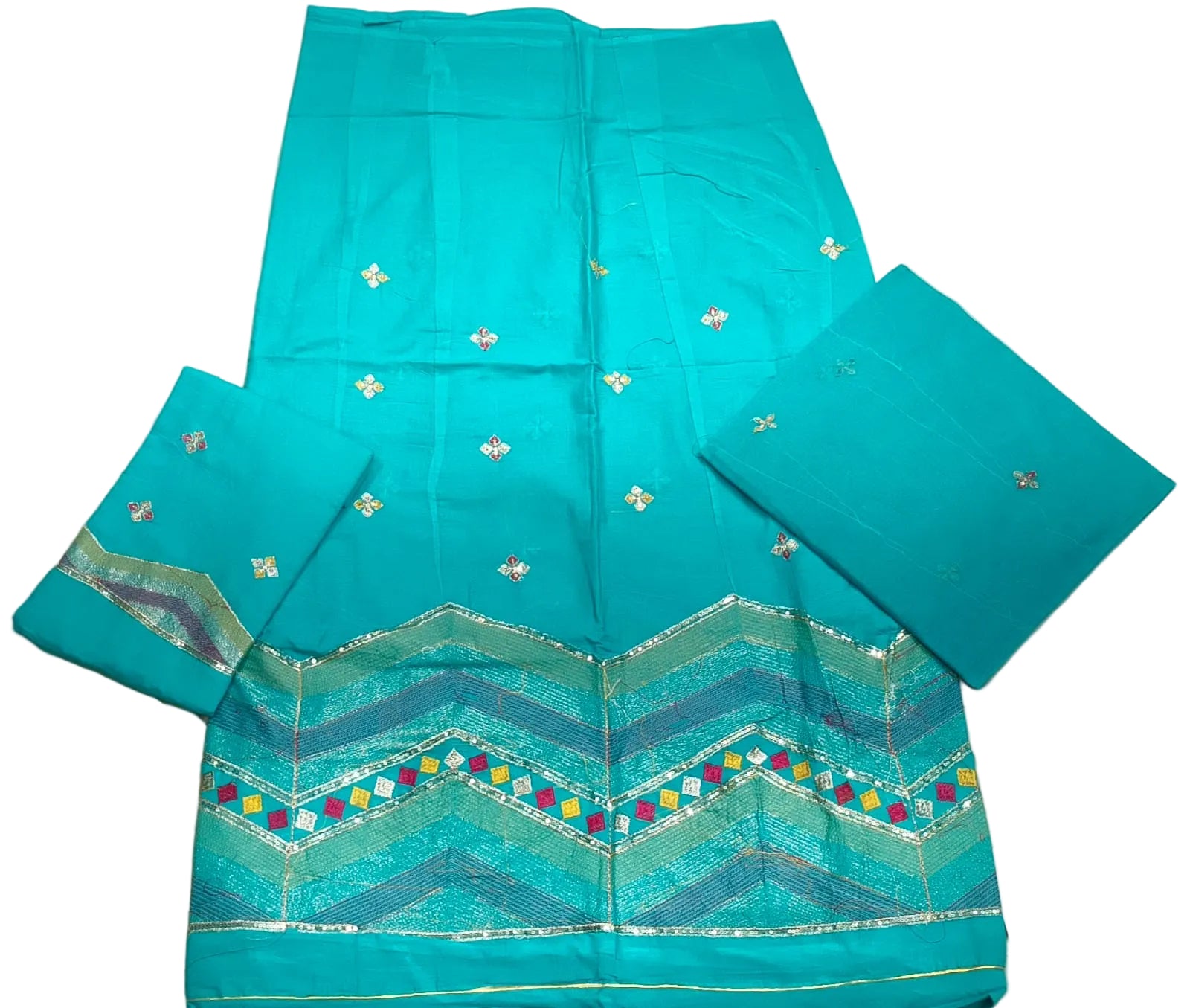 Turquoise fabric with decorative patterns on a white background