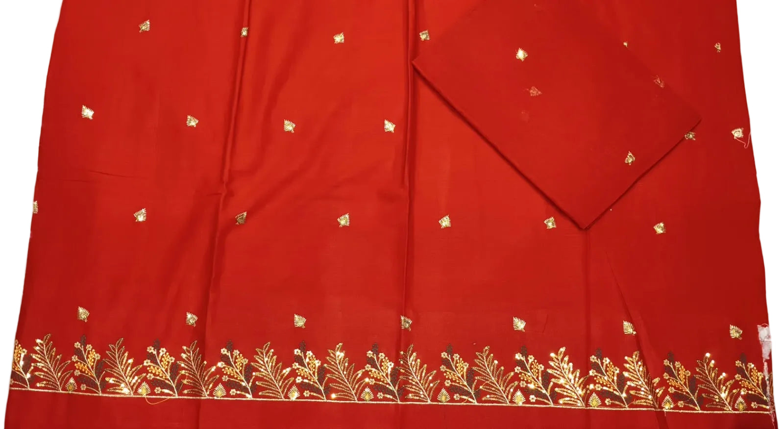 Red fabric with gold embroidery on a white background