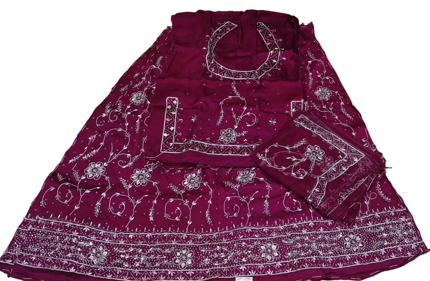 Maroon traditional outfit with white patterns on a white background