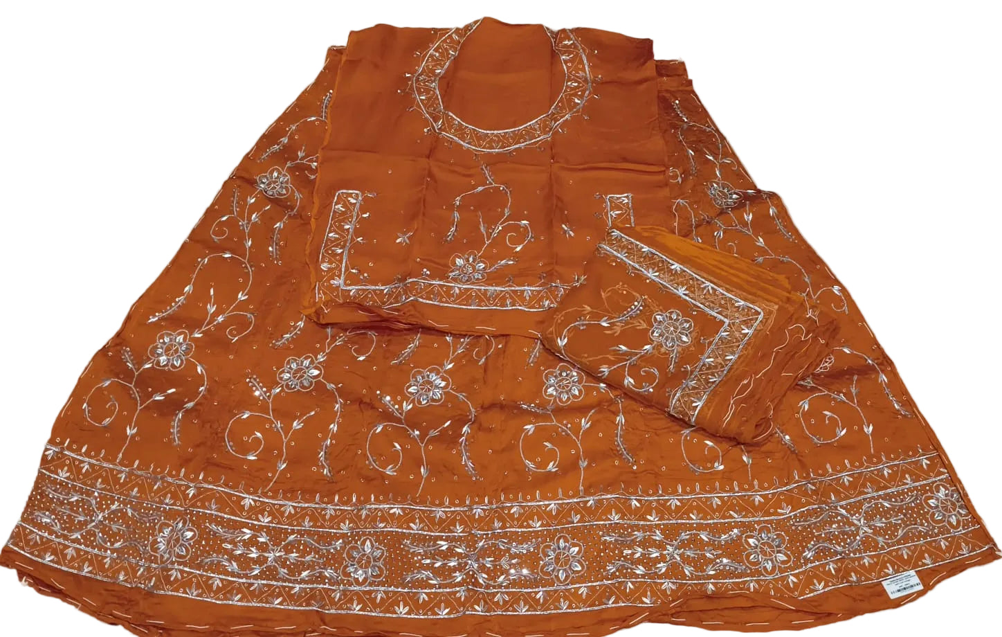 Orange traditional outfit with white embroidery on a white background