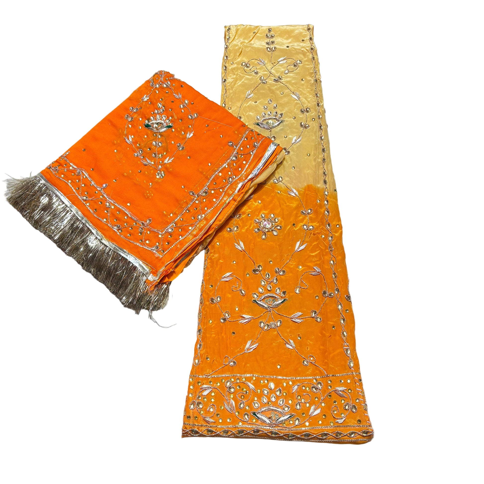 Orange fabric with gold embroidery on a light gray background