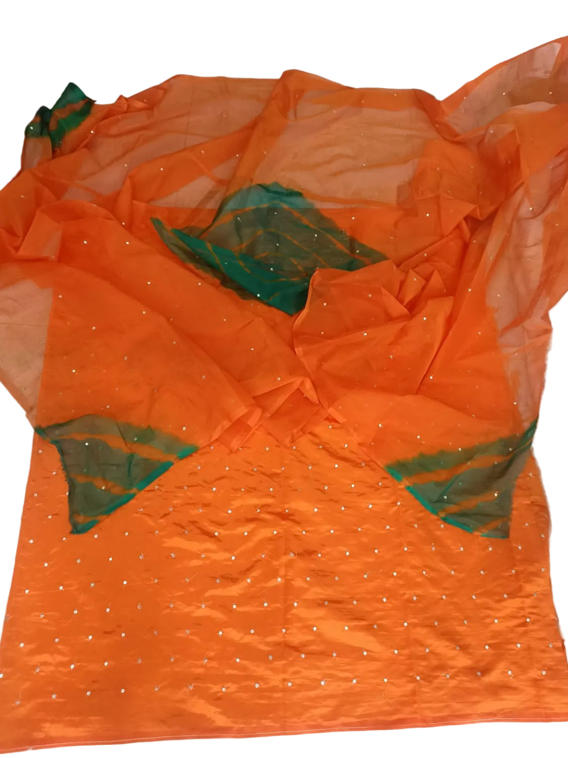 An orange sheer organza dupatta with scattered silver mirror work embellishments and green border accents, laid out on a light-colored floor.