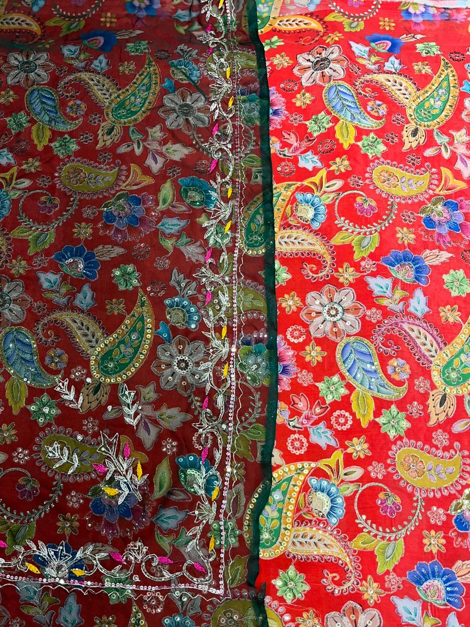 Colorful fabric with intricate patterns on a red background