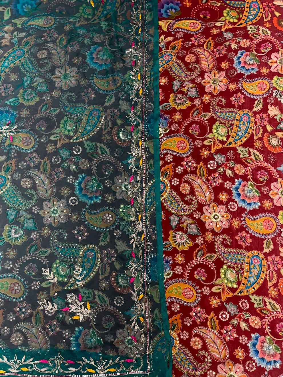 Two pieces of fabric with intricate paisley patterns in dark green and red colors.