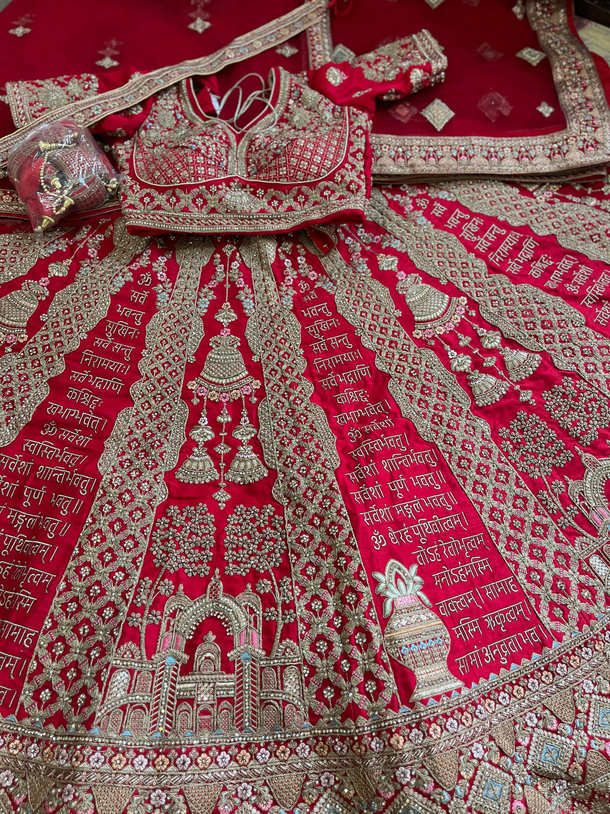 Red Silk Bridal Lehenga – Sanskrit Mantra Design | Zari + Stone Work