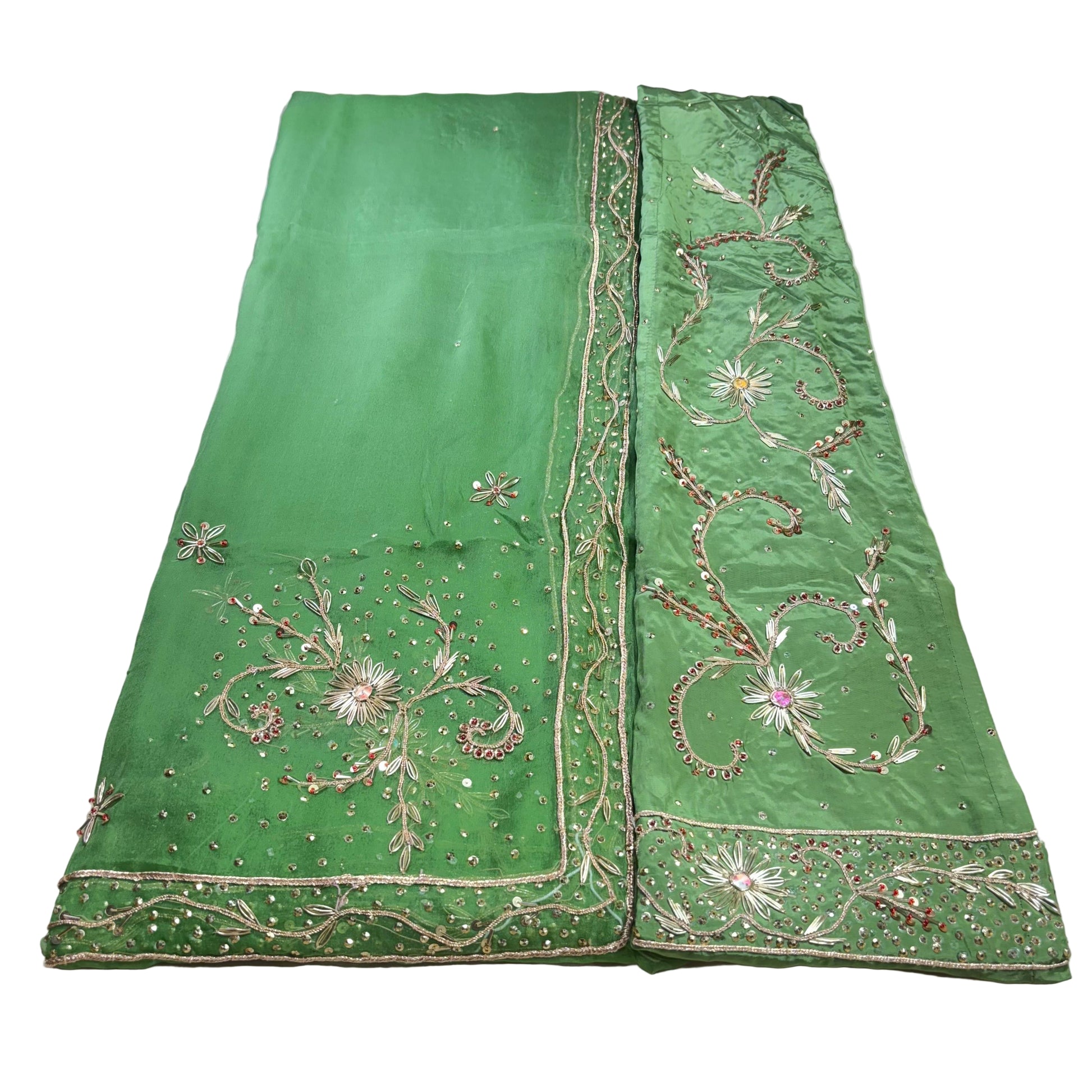 Green embroidered fabric on a white background