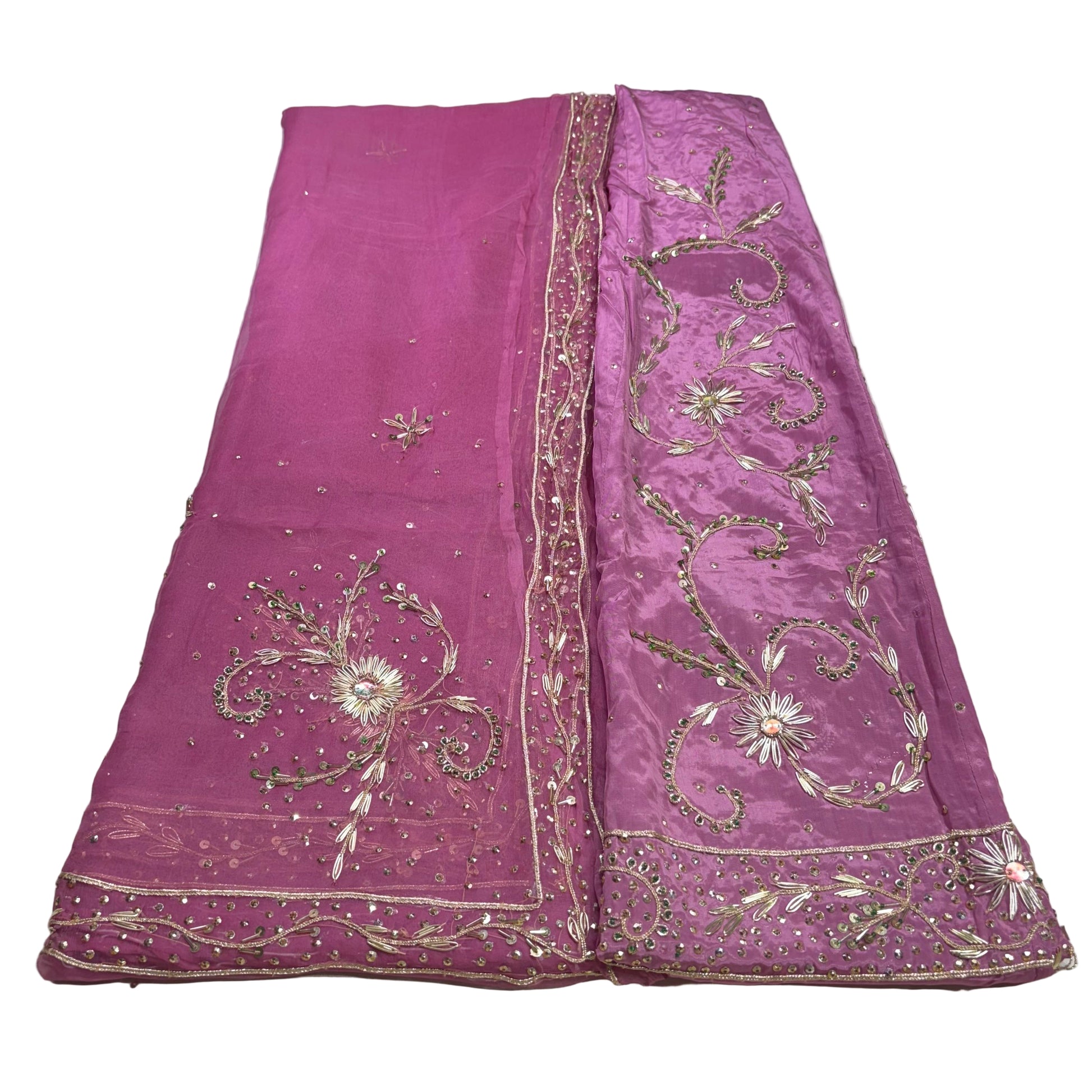 Purple fabric with intricate gold embroidery on a white background