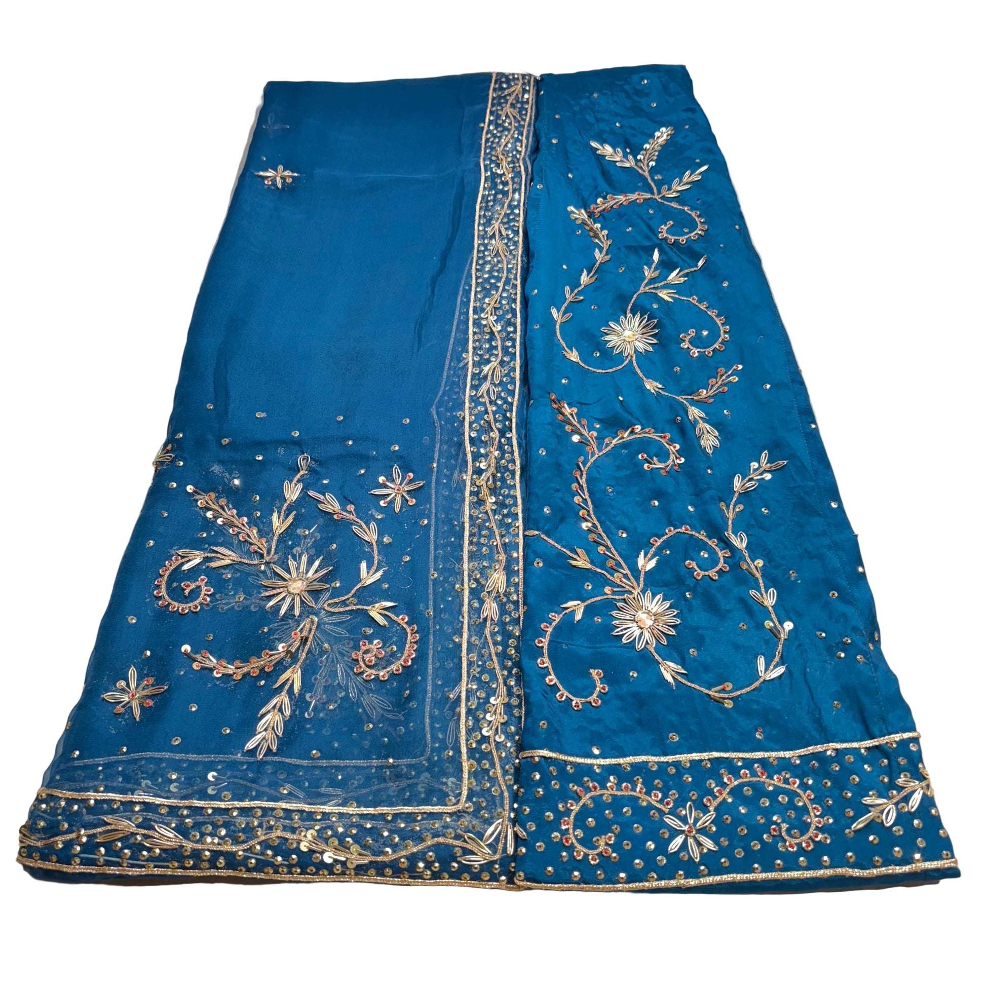 Blue embroidered fabric on a light gray background