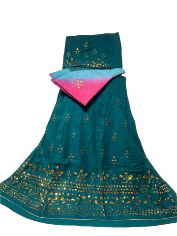 Teal embroidered fabric with gold patterns