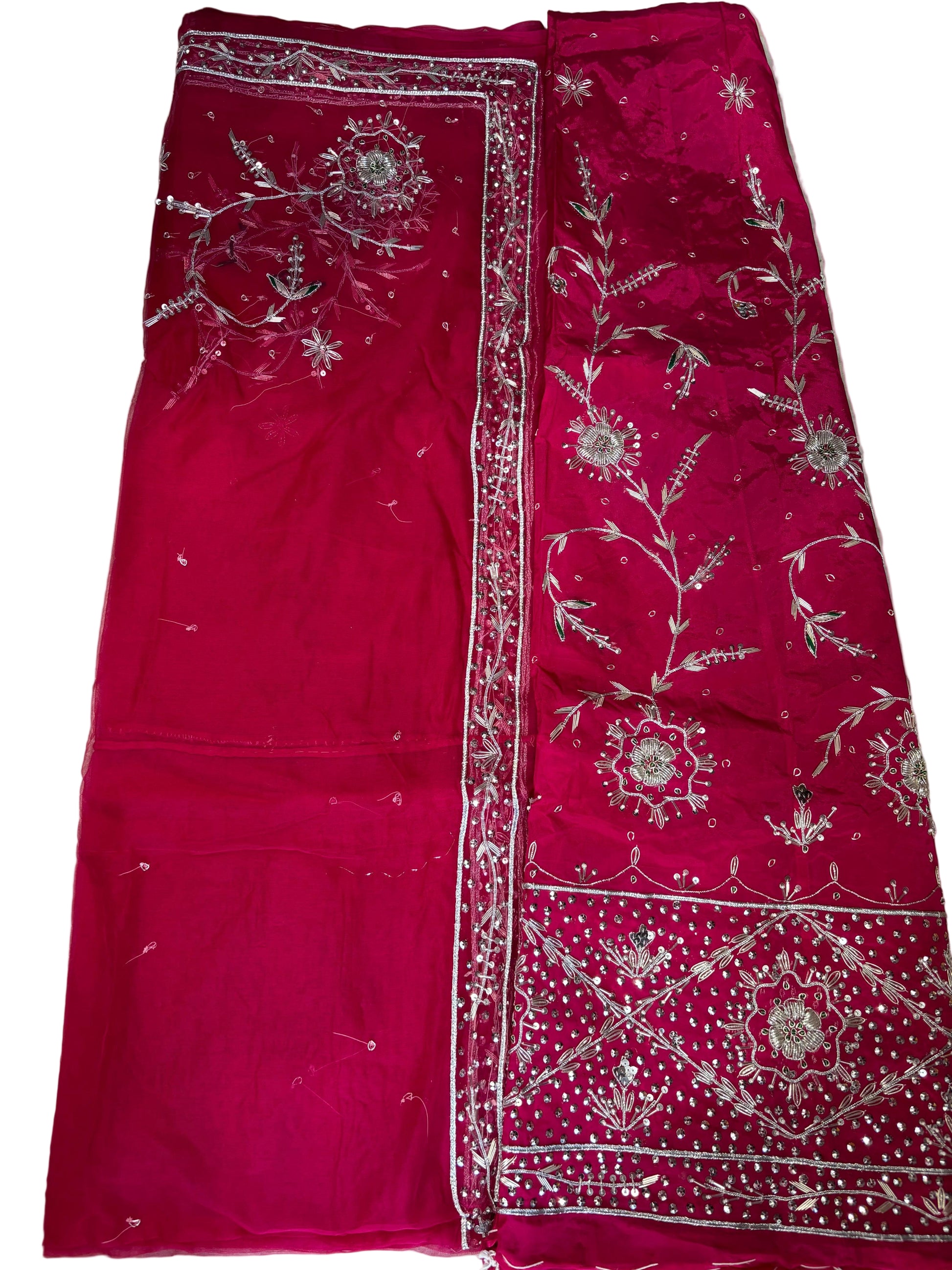 Red fabric with white embroidery on a light background