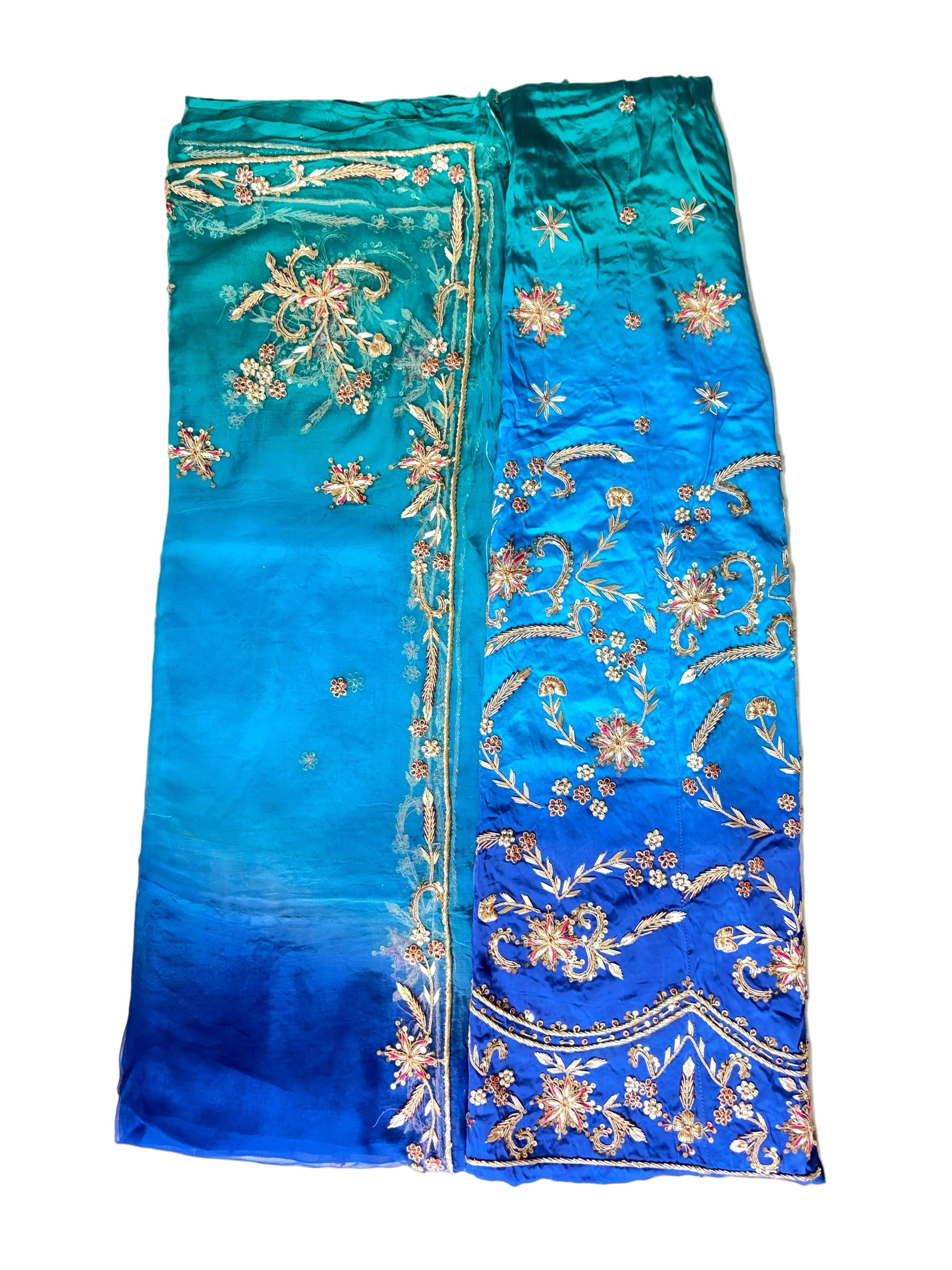 Blue fabric with gold embroidery on a white background
