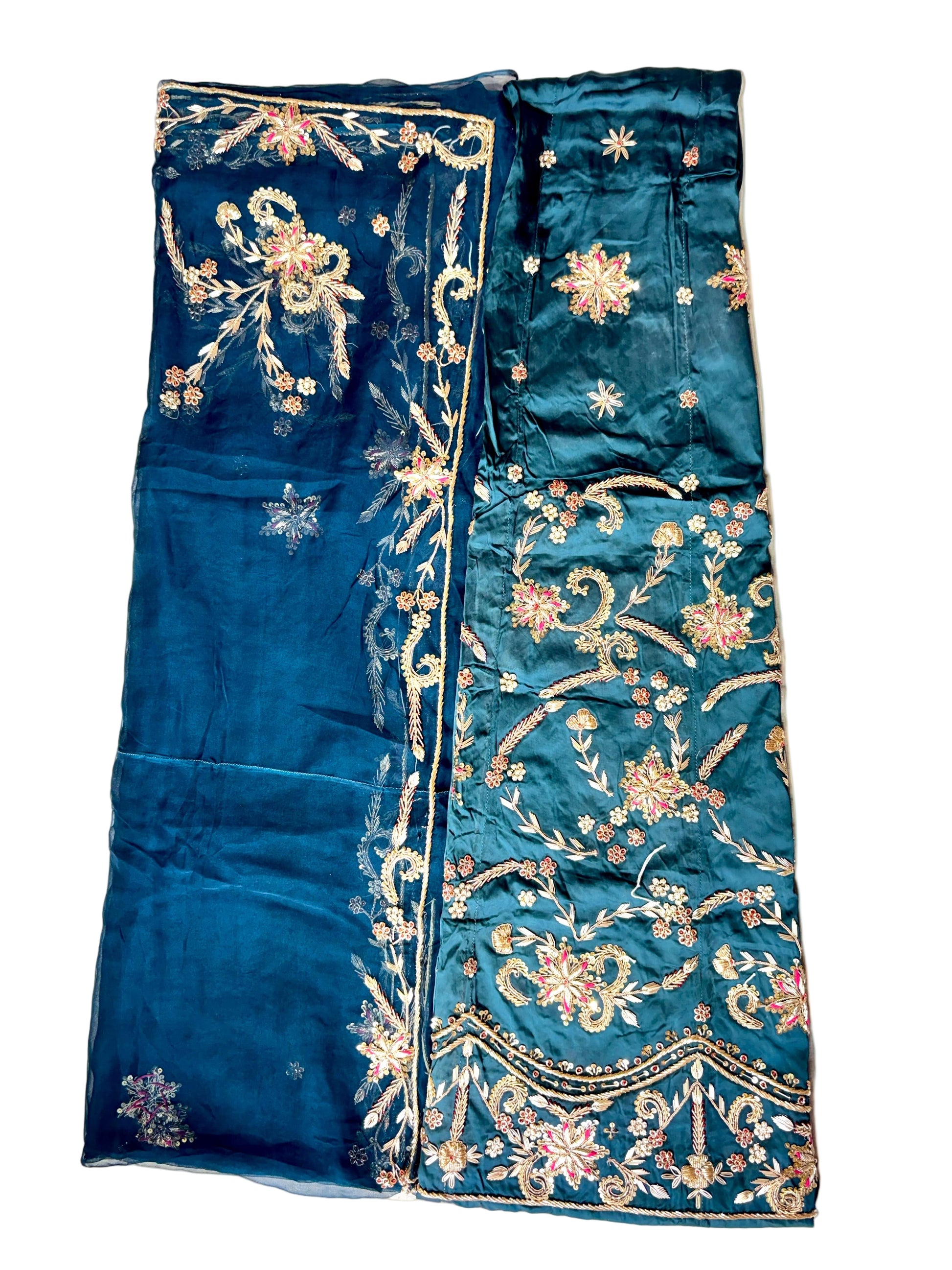 Blue embroidered fabric on a white background