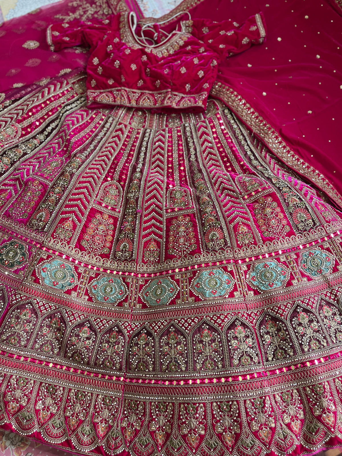 Rani Velvet Bridal Lehenga – Rangoli Design | Zari + Mirror Work