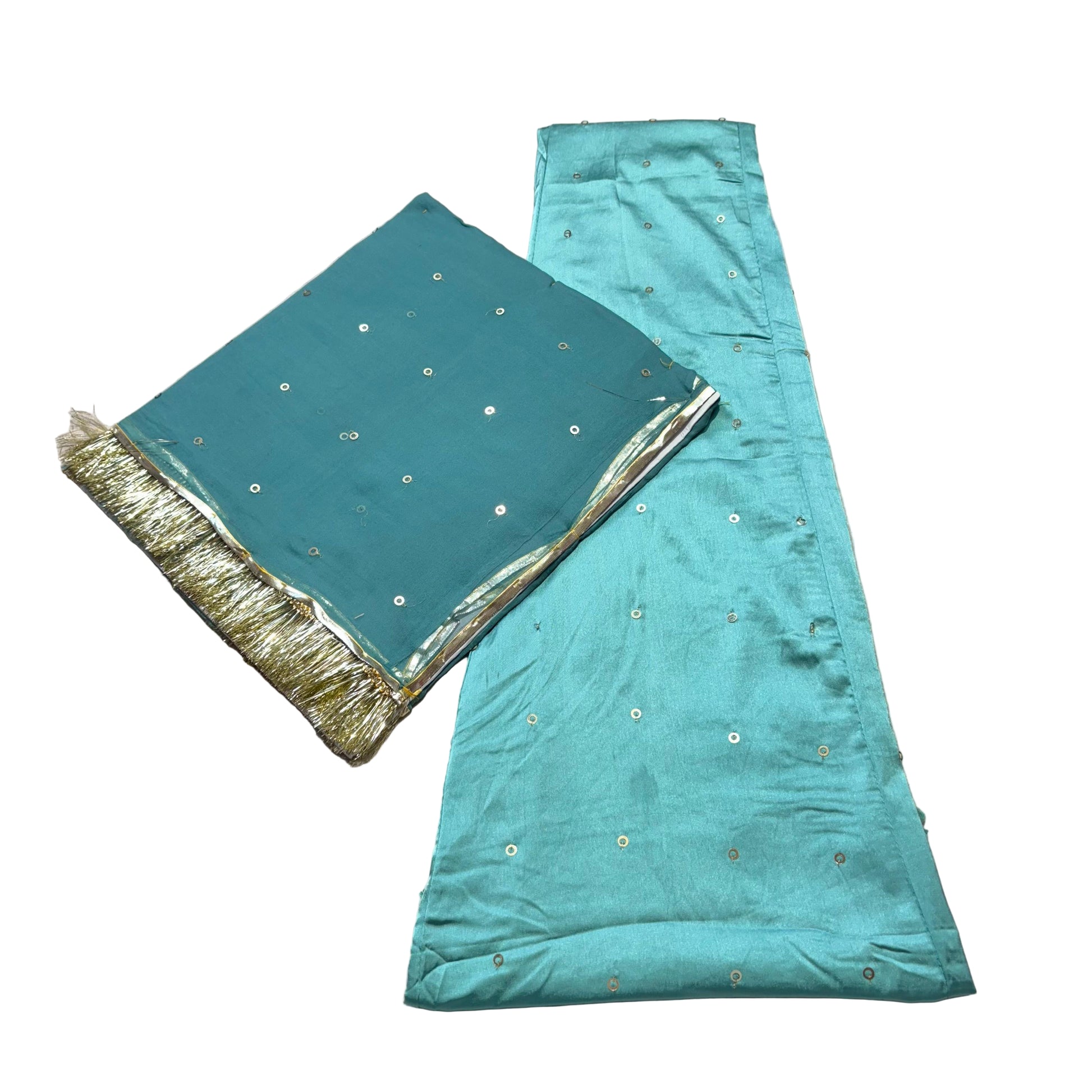 Teal fabric with gold trim on a beige surface