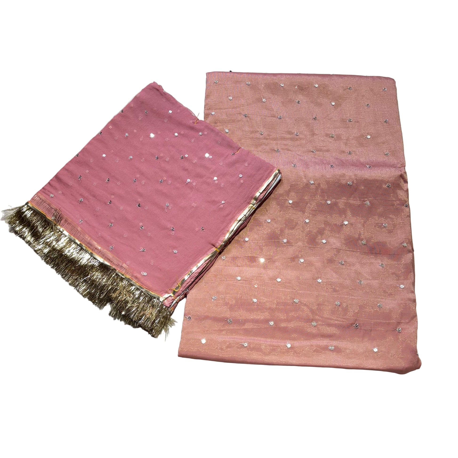 Pink fabric with gold fringe on a light gray background